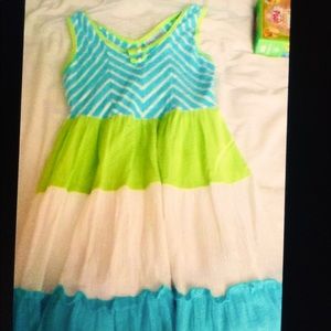 A green, blue, and white dress with white stripes.